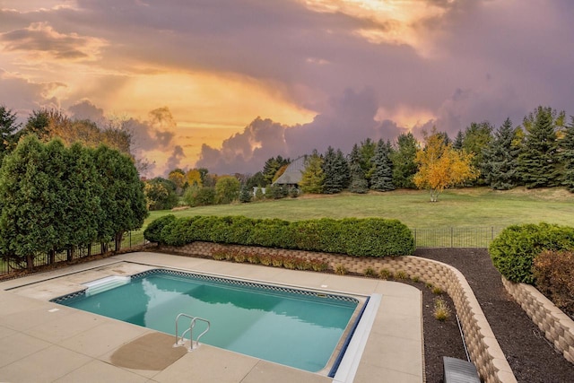 view of pool featuring fence, a fenced in pool, a patio area, and a yard