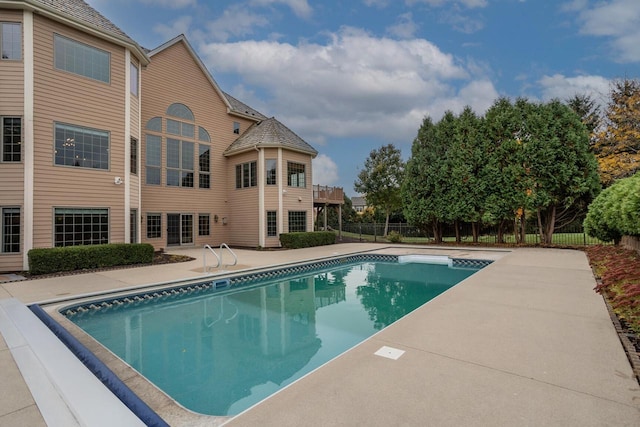 view of pool featuring a patio area, a fenced in pool, and fence