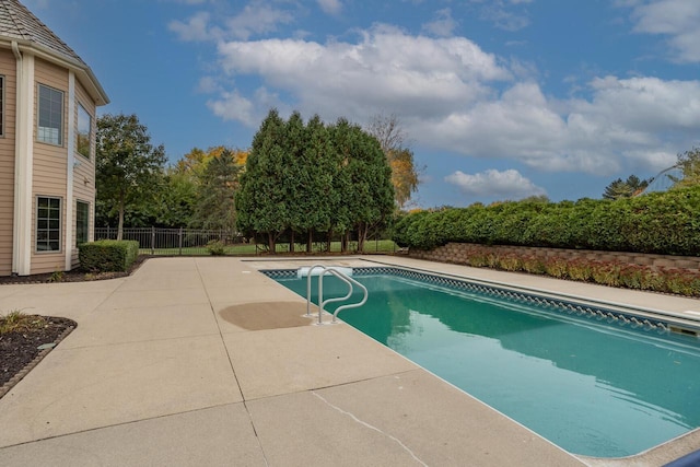 view of swimming pool featuring a fenced backyard, a patio, and a fenced in pool