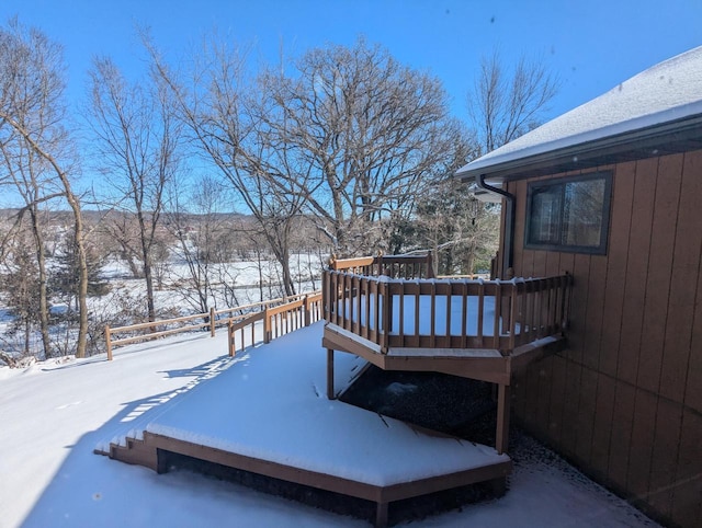 view of snow covered deck