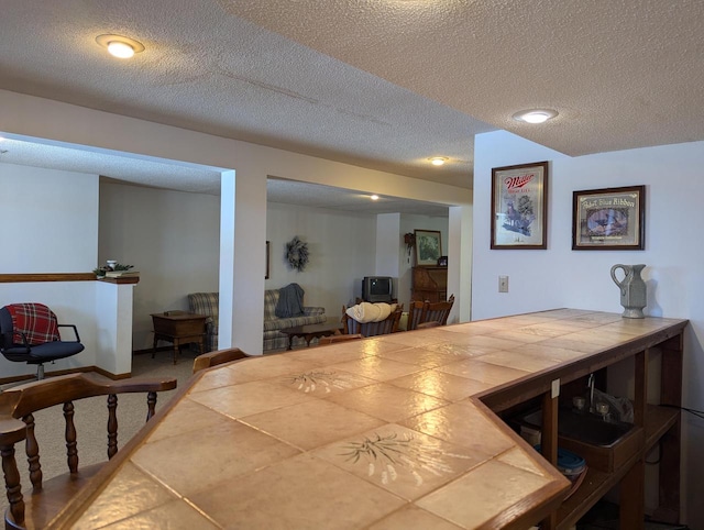 dining room featuring a textured ceiling