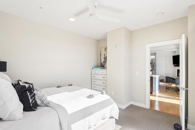 bedroom featuring hardwood / wood-style flooring and ceiling fan