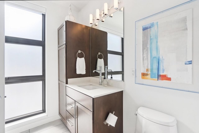 bathroom featuring toilet and vanity