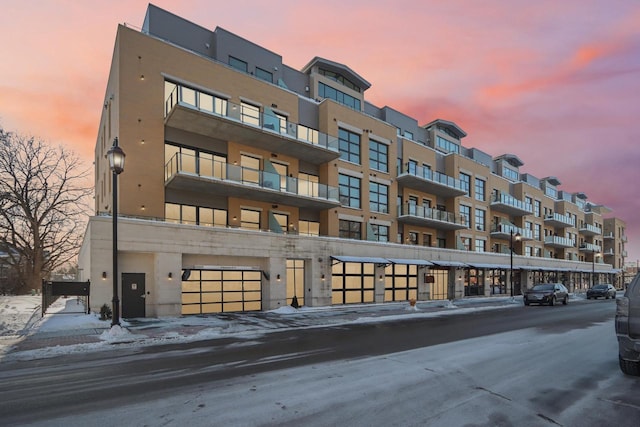 view of outdoor building at dusk