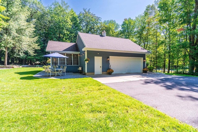 view of front of house featuring a front lawn and a patio