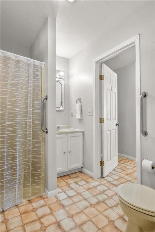 full bath with a shower with curtain, vanity, and baseboards