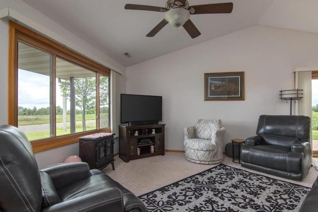 carpeted living room featuring visible vents and vaulted ceiling