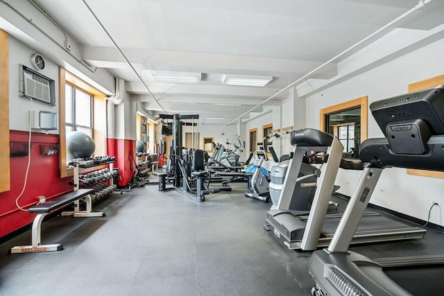 gym featuring an AC wall unit