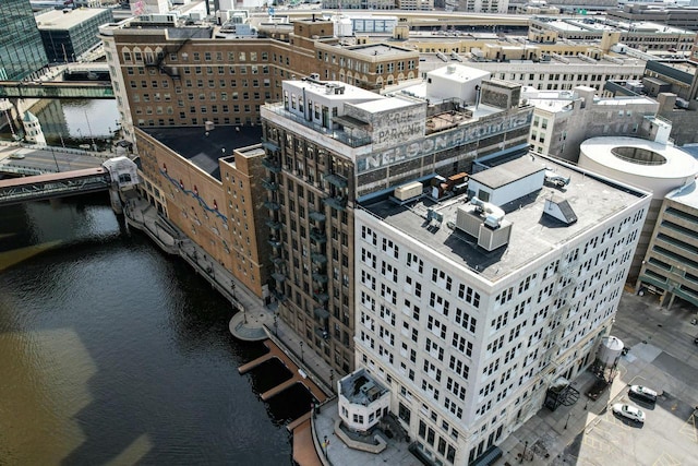 birds eye view of property with a view of city and a water view