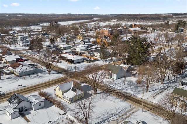 snowy aerial view featuring a residential view