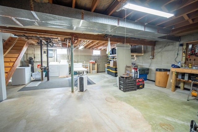 below grade area with stairway and washer and dryer