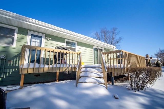 view of snow covered deck