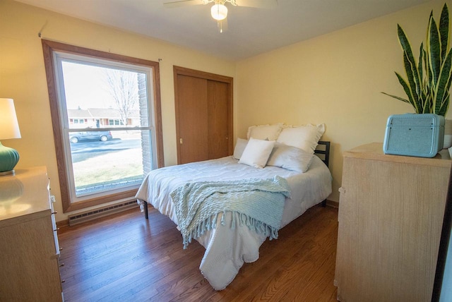 bedroom with a closet, visible vents, ceiling fan, and wood finished floors