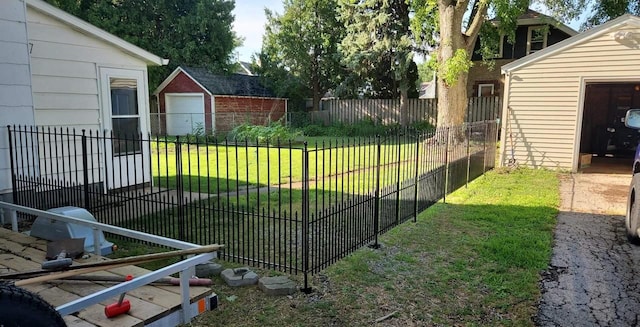 view of yard with an outdoor structure and fence