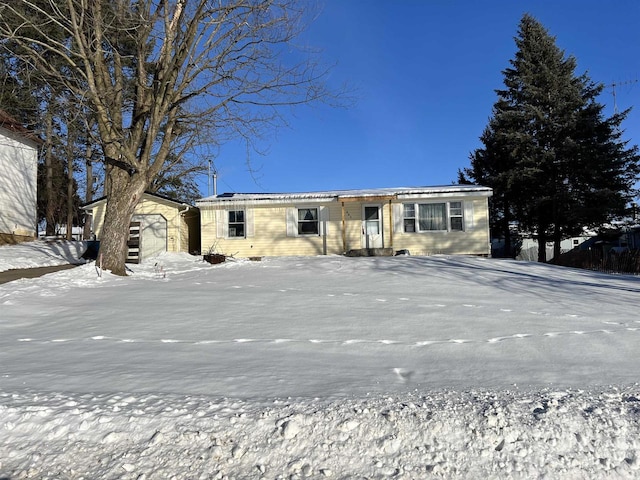 view of front of house featuring an outbuilding