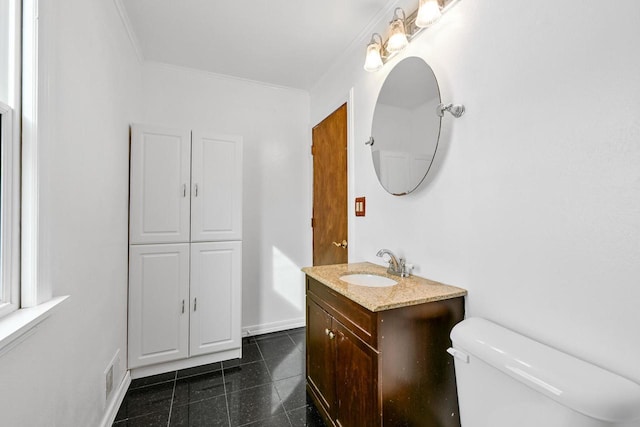 bathroom featuring crown molding, vanity, visible vents, toilet, and tile patterned floors