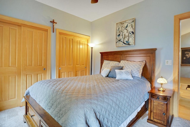 bedroom with ceiling fan and light carpet