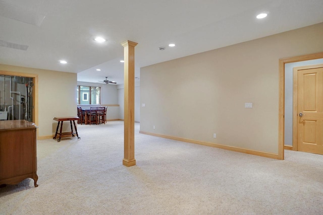 basement featuring baseboards, recessed lighting, light colored carpet, and a ceiling fan