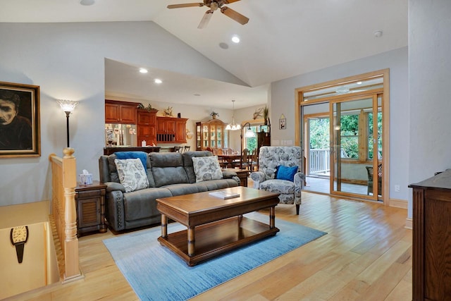 living room with high vaulted ceiling, recessed lighting, ceiling fan, and light wood-style floors