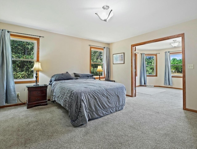 carpeted bedroom with baseboards