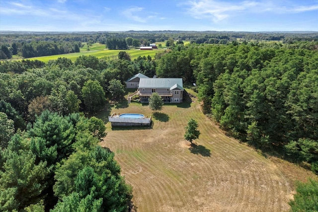 birds eye view of property with a rural view and a view of trees