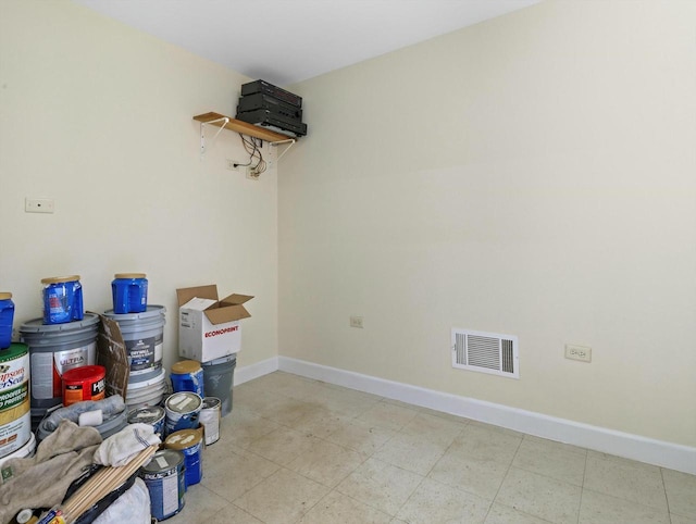 empty room with visible vents and baseboards