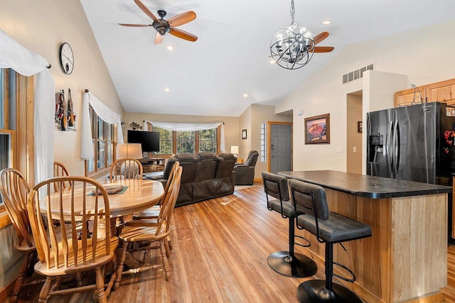 dining room with recessed lighting, visible vents, light wood finished floors, and ceiling fan with notable chandelier