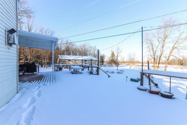 view of yard layered in snow