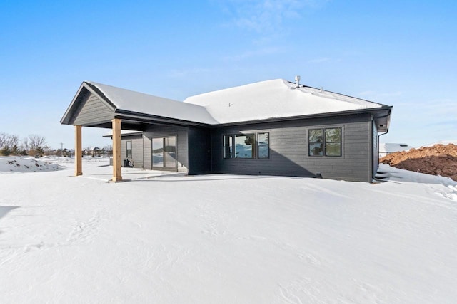 view of snow covered house