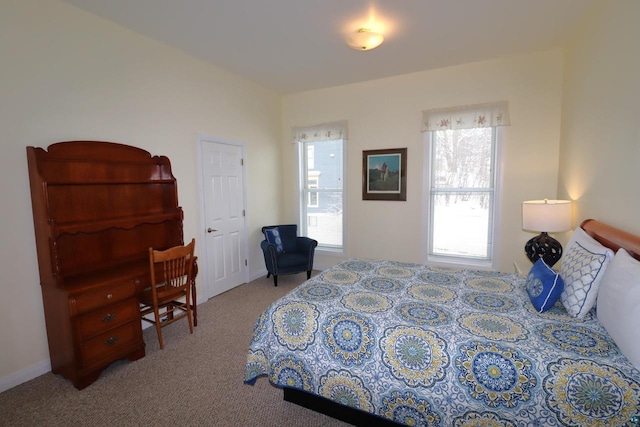 bedroom with light colored carpet