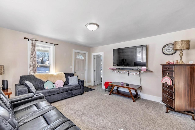 living room with baseboards and light colored carpet