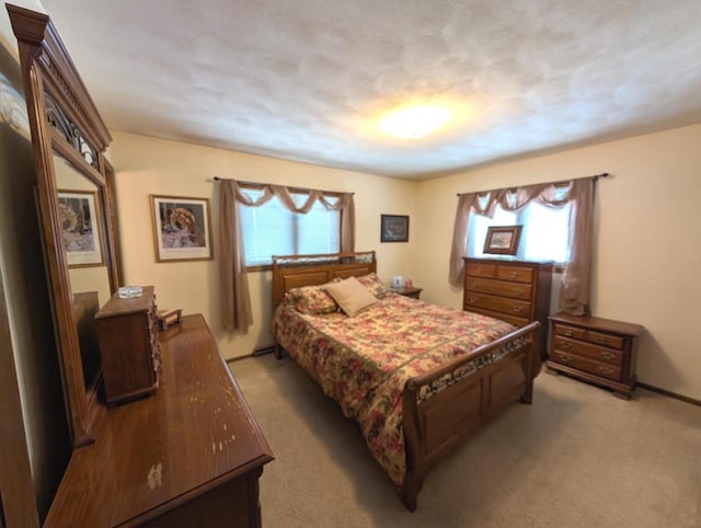 bedroom with light colored carpet