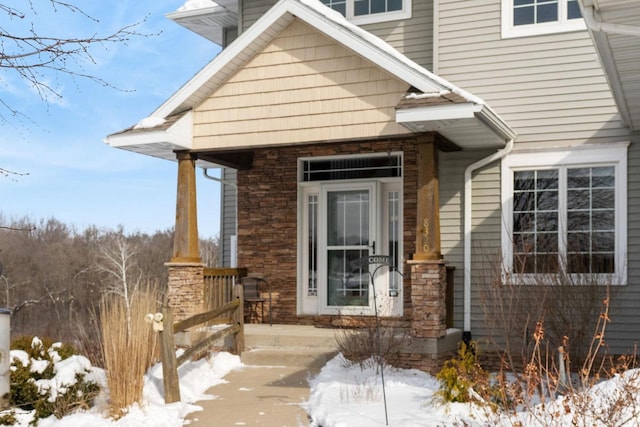 view of snow covered property entrance