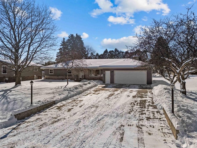 single story home featuring a garage