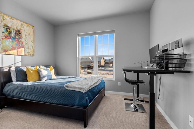 bedroom featuring carpet flooring and baseboards