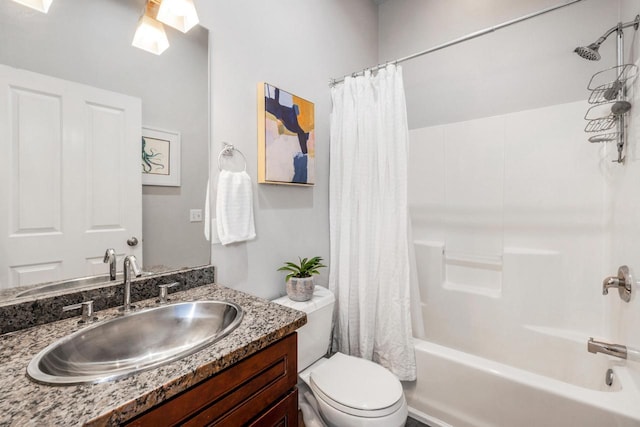 full bath with toilet, shower / bath combo with shower curtain, and vanity