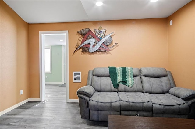 living room with baseboards and wood finished floors