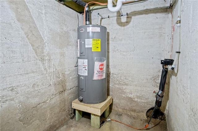 utility room with electric water heater