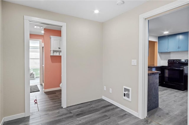 interior space featuring visible vents, baseboards, dark wood finished floors, and recessed lighting