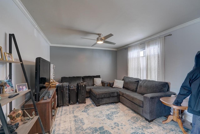 living area with ceiling fan and crown molding