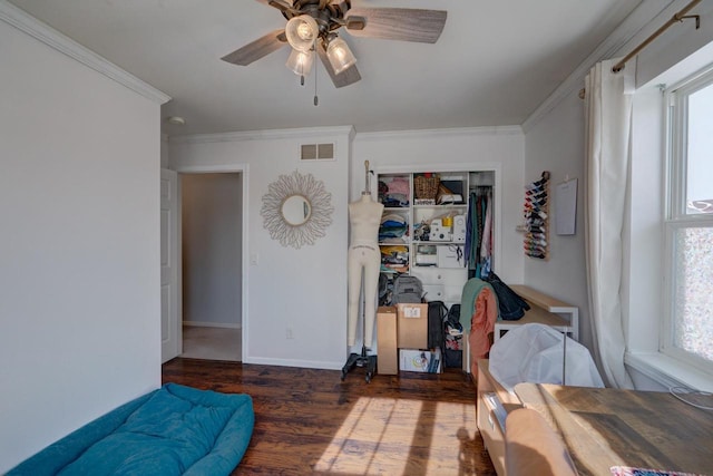 bedroom with ceiling fan, multiple windows, dark wood finished floors, and crown molding