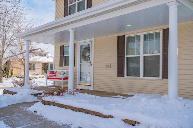 view of snow covered property entrance