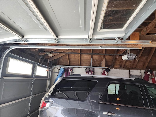 garage featuring a garage door opener