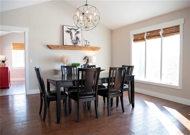 dining area featuring baseboards, a chandelier, vaulted ceiling, and dark wood-style flooring