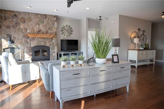 interior space featuring ceiling fan, dark wood-style flooring, a fireplace, and recessed lighting