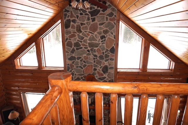 interior space featuring rustic walls, wood ceiling, and high vaulted ceiling