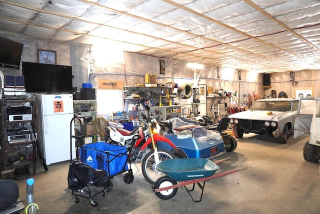 garage featuring freestanding refrigerator