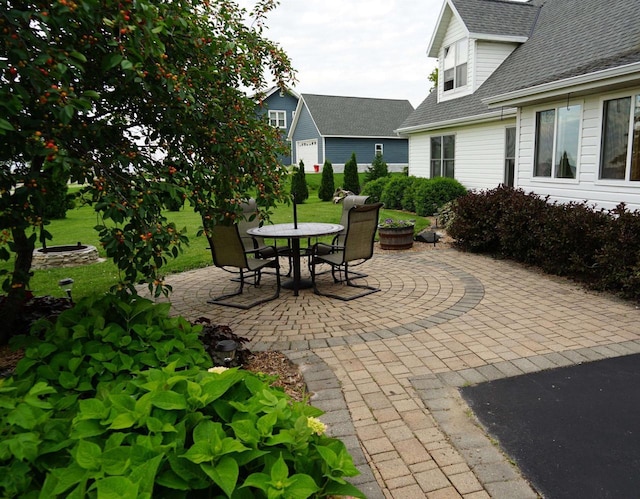 view of patio featuring outdoor dining area