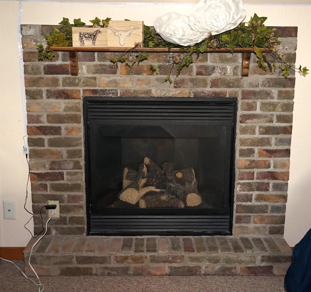 room details featuring a brick fireplace