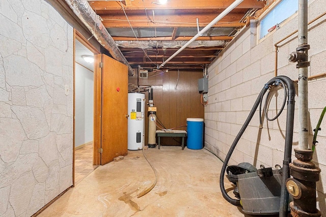 unfinished basement with water heater and concrete block wall